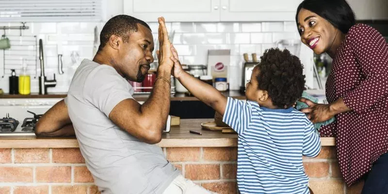 father son high five 