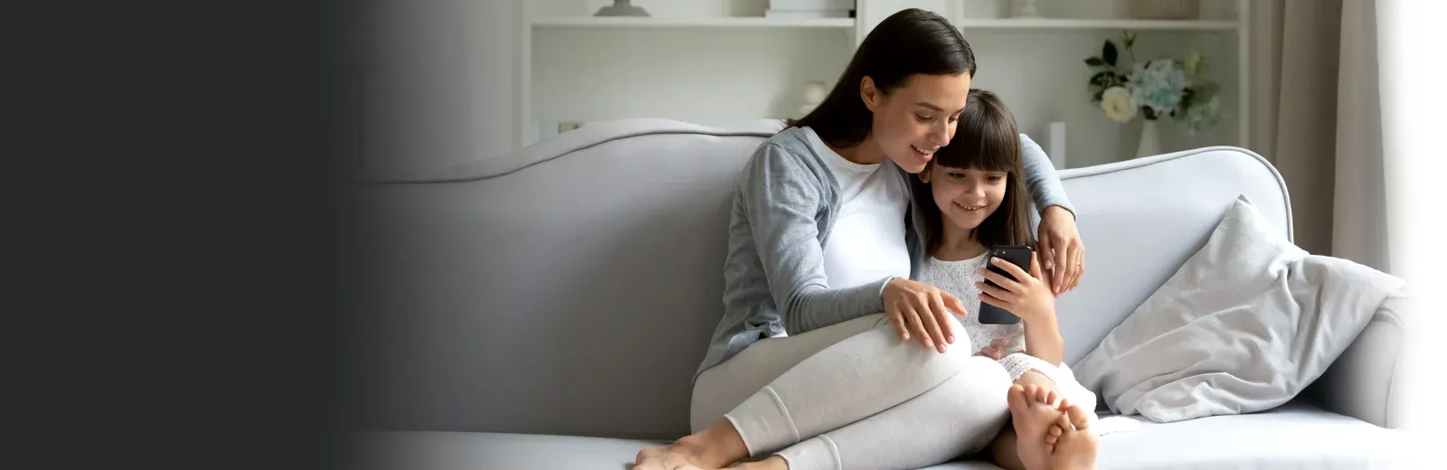Mother and daughter watching phone