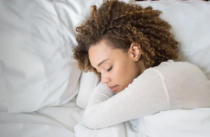 woman sleeping in bed bug free bed