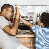 father son high five 