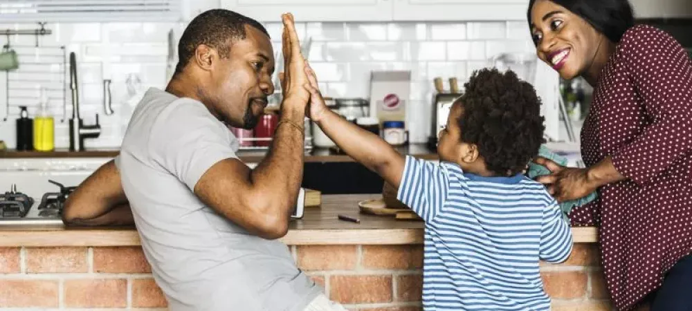 father son high five