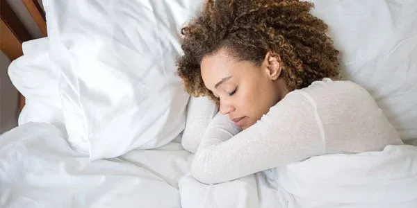 woman sleeping in bed bug free bed